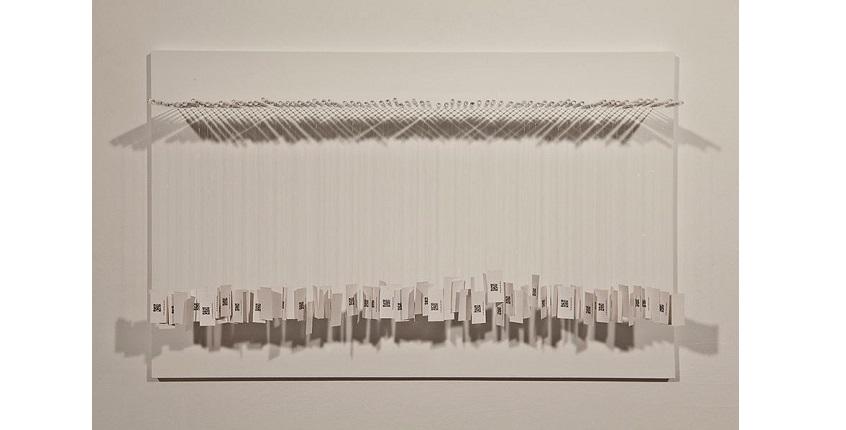 Rocío Garriga. "One year in minutes of silence", 2013. Glass, digital printing on paper and nylon. 50 x 80 x 16 cm.