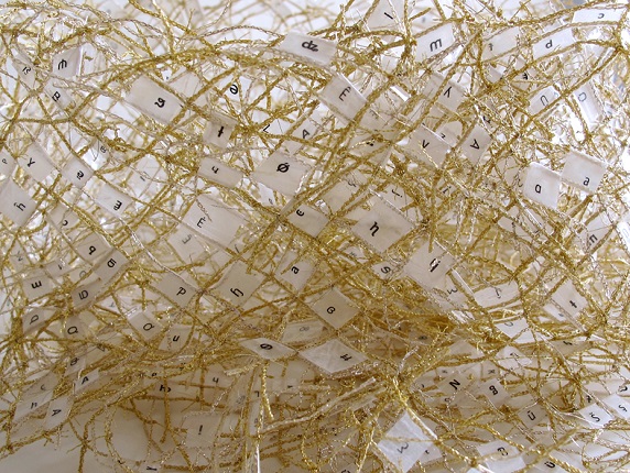 "Moebius Ribbon", 2016. Woven gold thread, adhesive plastic and printed paper. 50 x 90 x 0,5 cm.
