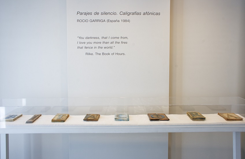 "Bitácora", 2015. Sheets of old books of different subjects intervened with colored wax and candle wick. 23 x 240 x 4 cm.