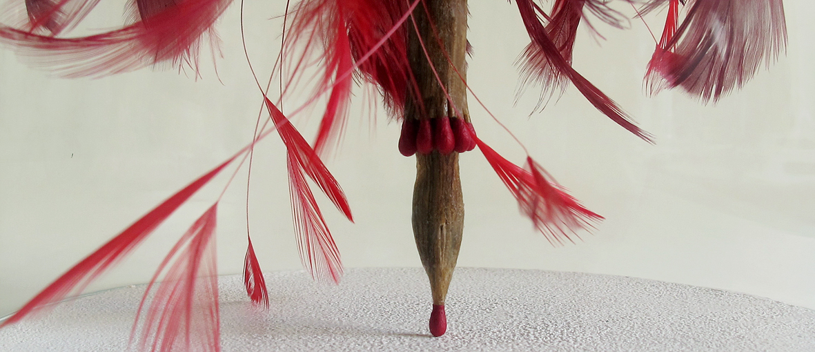 "The Poet’s wings X", 2016. Matches, feathers, wood, sandpaper and glass lantern. 29,5 x 15,5 cm.