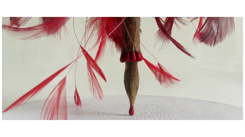 "The Poet’s wings X", 2016. Matches, feathers, wood, sandpaper and glass lantern. Writing pen protected by a glass beacon, on wooden base lined with sandpaper.